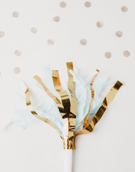 white and brown foil party decor on white panel