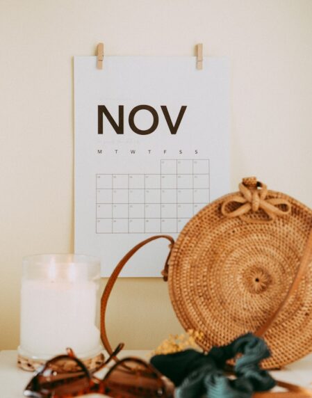 shallow focus photo of calendar mounted on white wall