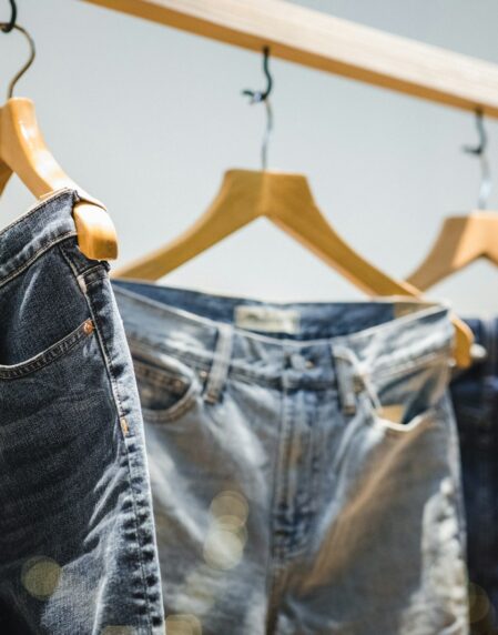 selective focus photography of hanged denim jeans
